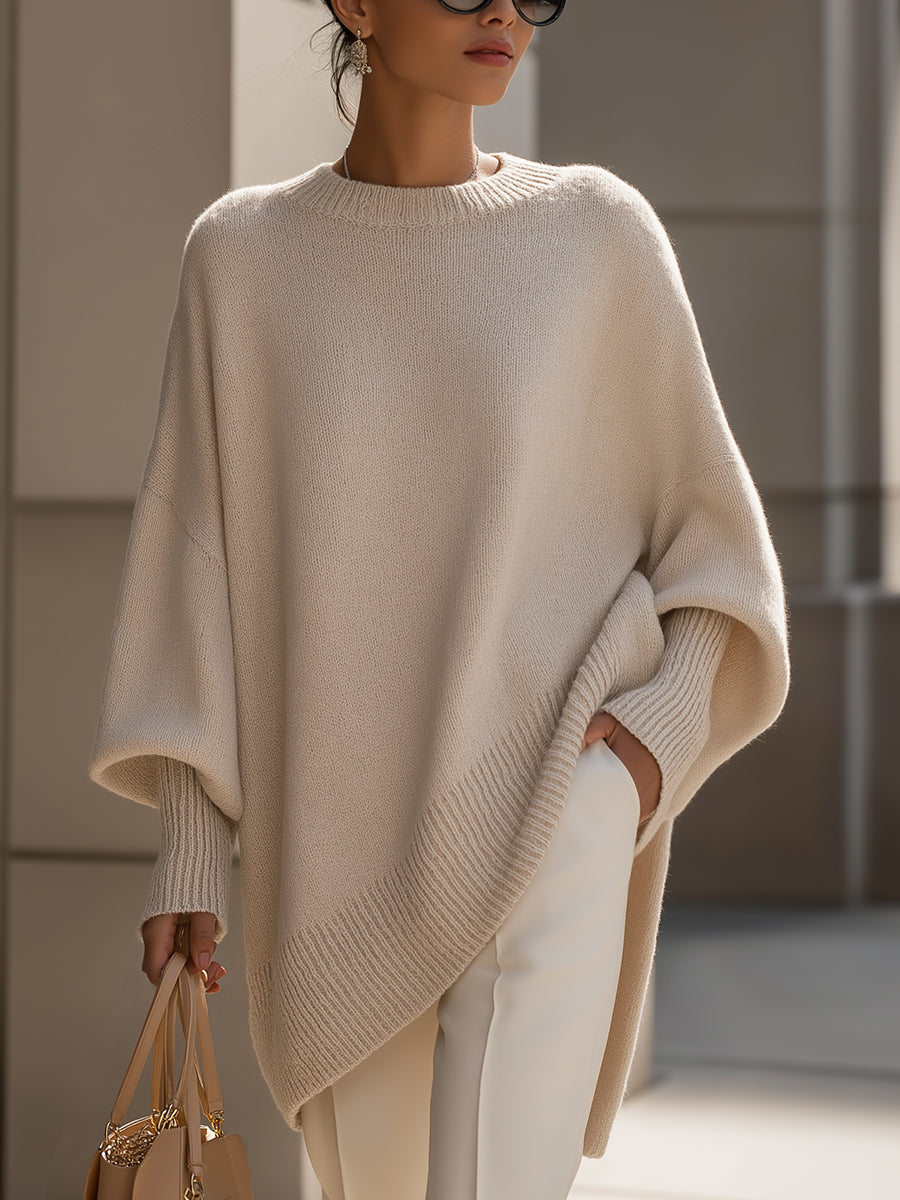 Women's asymmetric hem jumper side profile showing uneven hemline