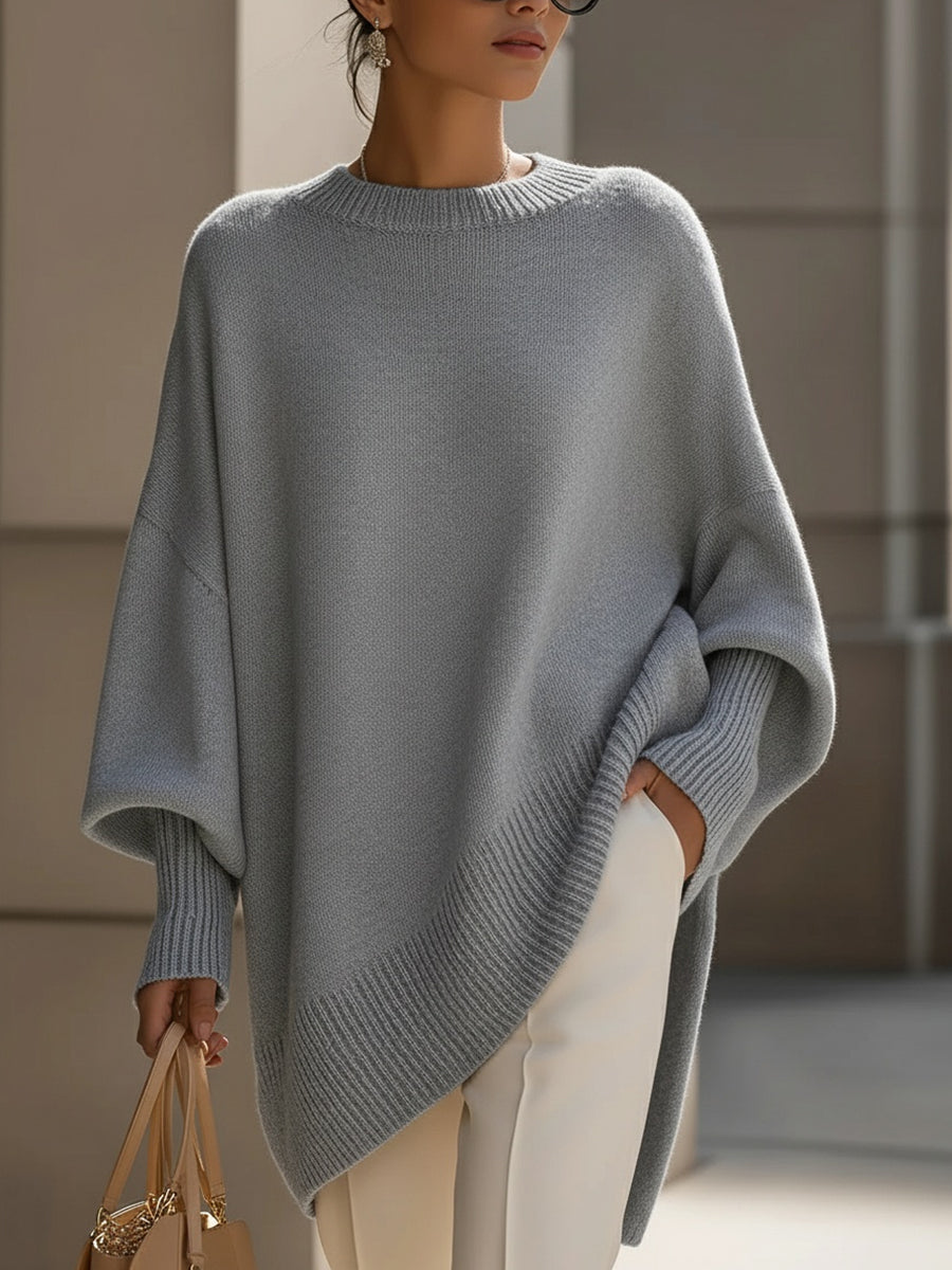 Women's asymmetric hem jumper close-up of round neckline