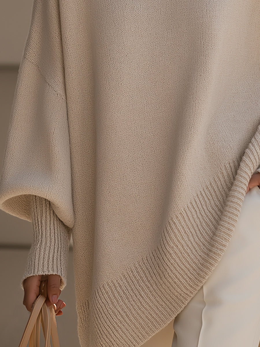 Women's asymmetric hem jumper worn with trousers