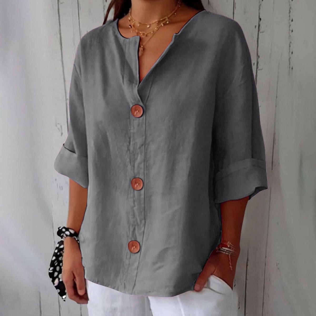 Short-sleeve blouse showing open cuffs