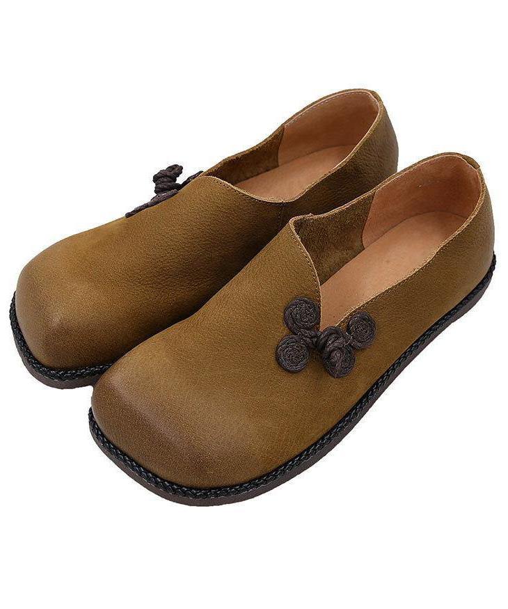 Top view of loafers highlighting knotted floral accent on the vamp