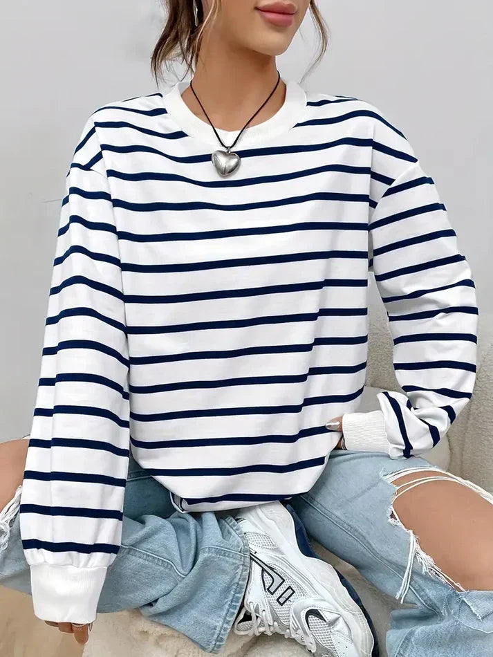 Women's striped crew neck sweatshirt side view showing dropped shoulders