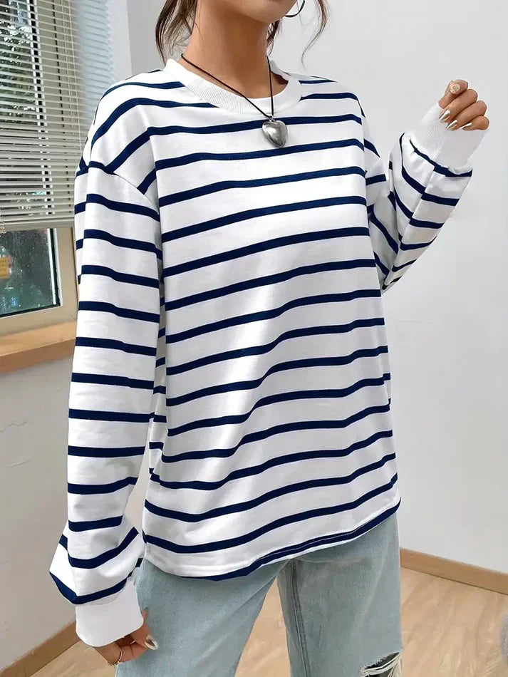 Women's striped crew neck sweatshirt close-up of ribbed cuff and stripe detail