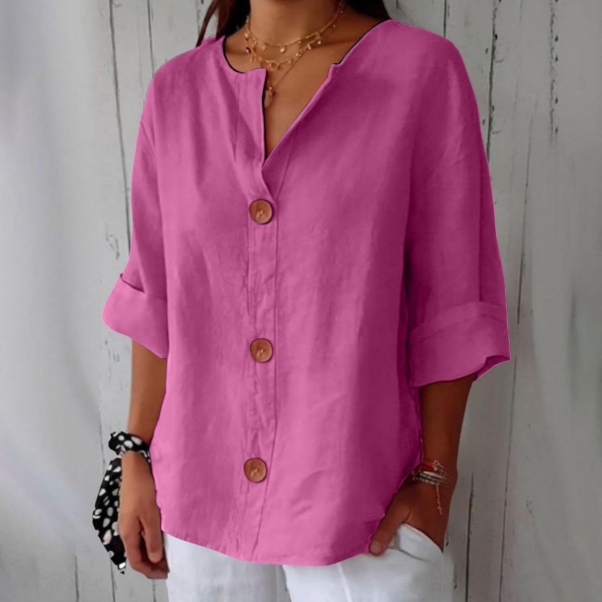 Relaxed blouse styled with trousers