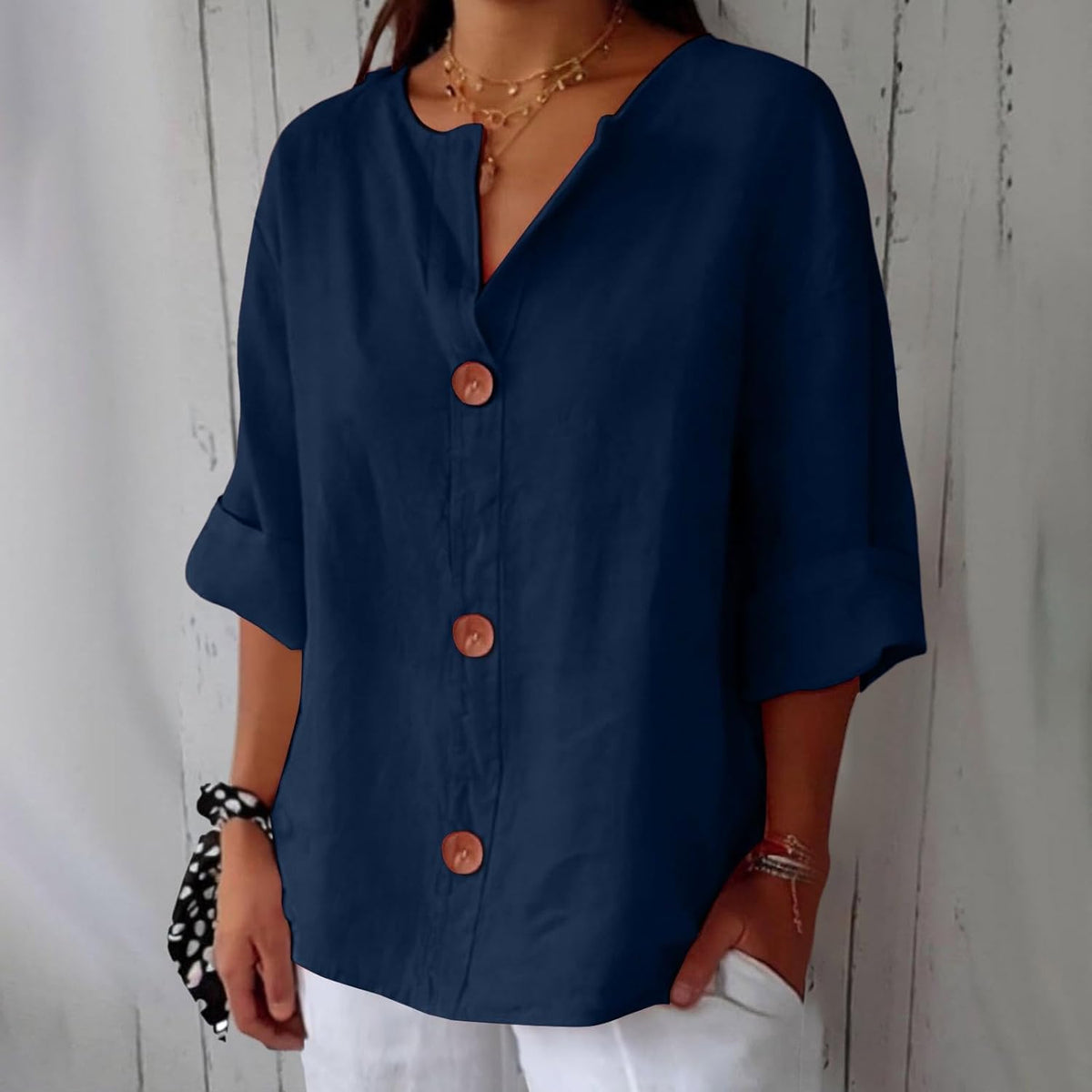 Blouse worn tucked at the front